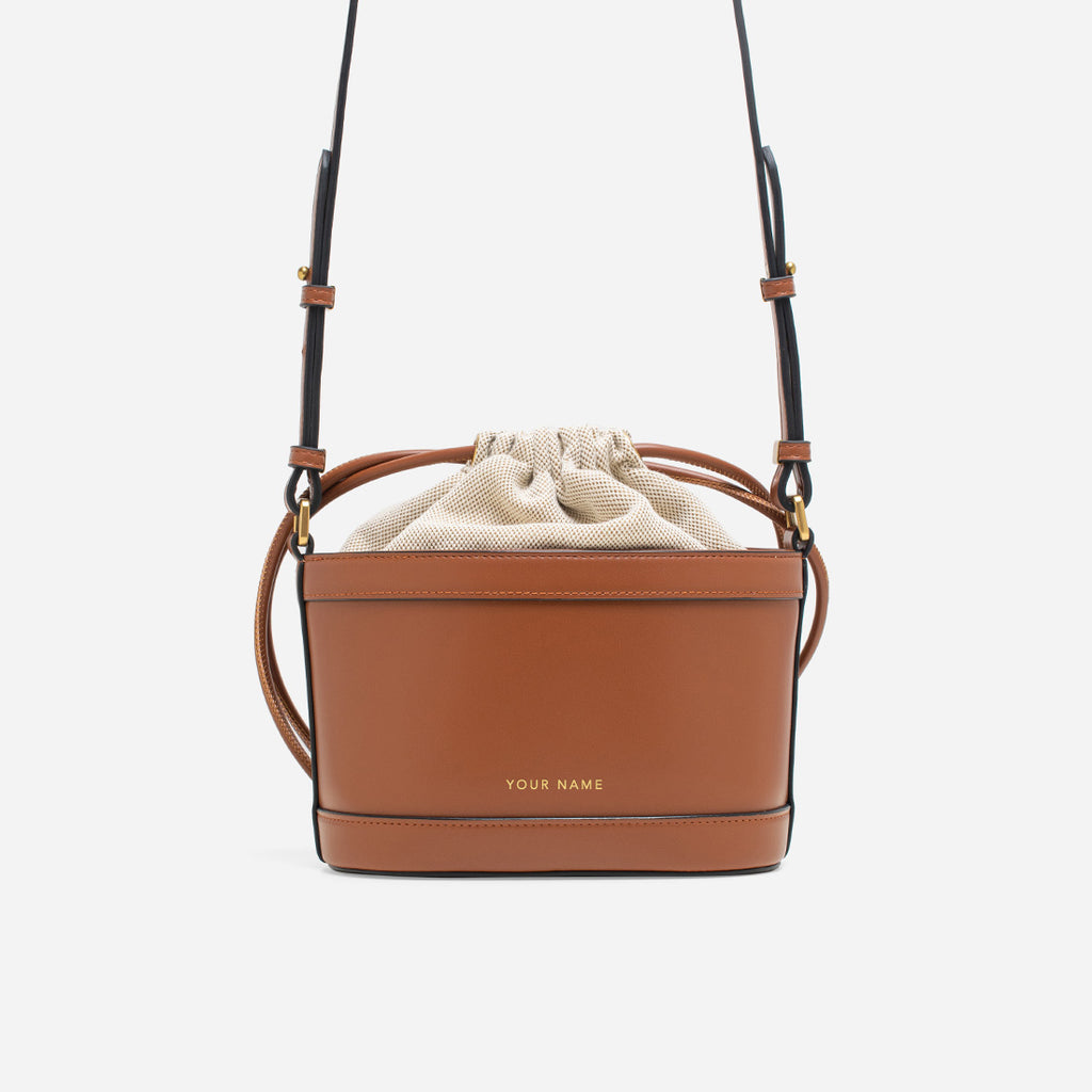 ChristyNg.com - The timeless yet minimalist bucket bag has climbed the  ranks of handbag fame for years due to its utilitarian & chic silhouette.  Double tap to grab yours today.